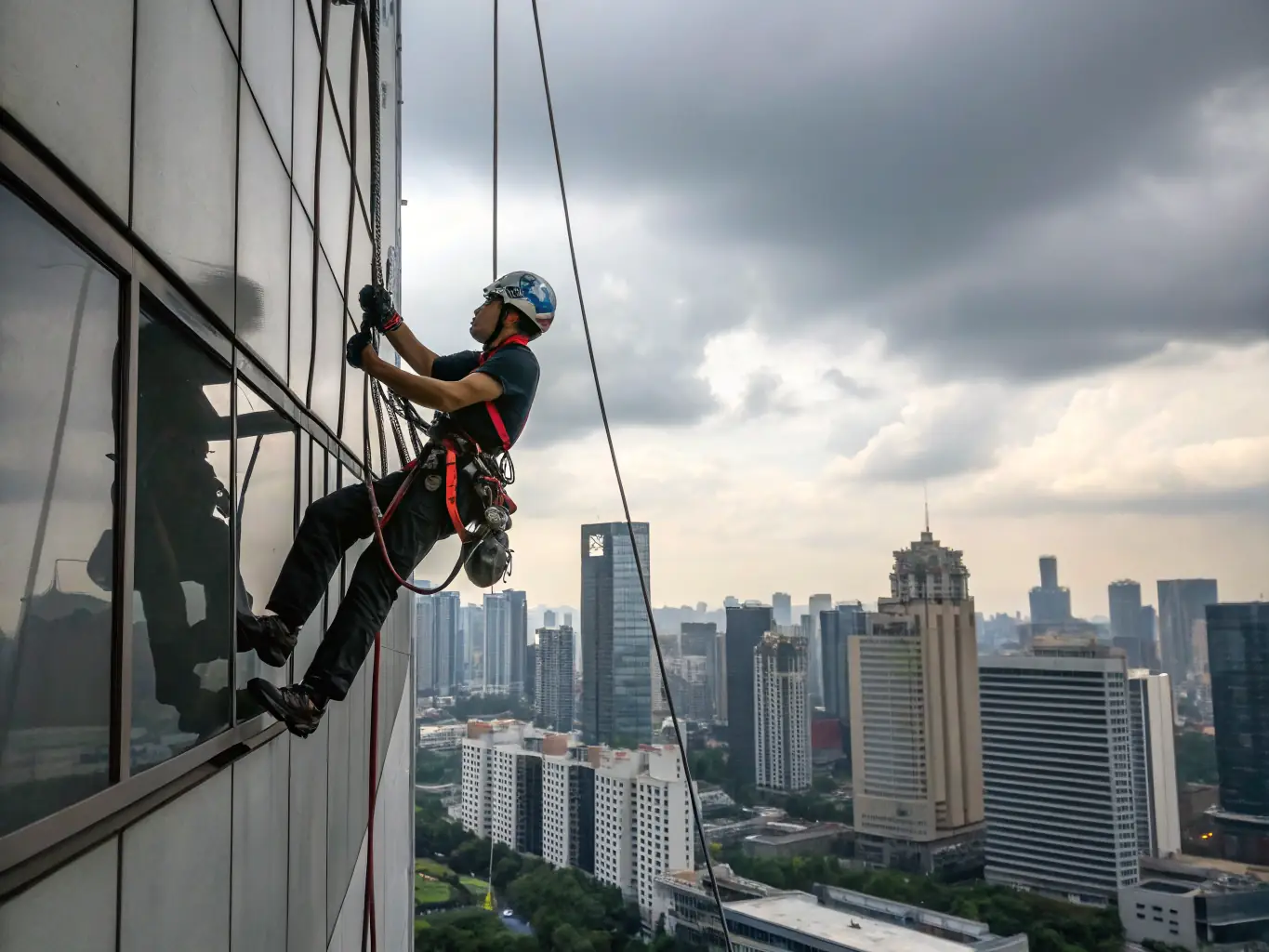 A Span Shield technician installing bird netting on a high-rise balcony, with cityscape in the background, showcasing specialized pest and bird control services.